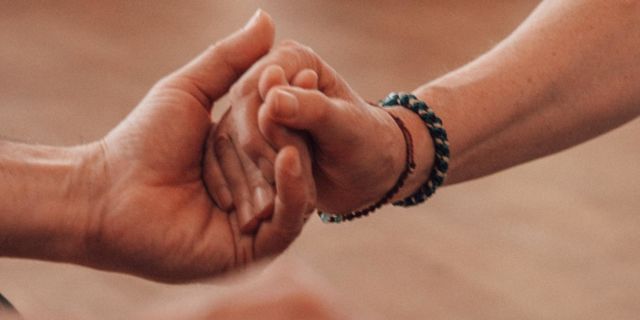 Body:Mind:Breath - Hand holding arm